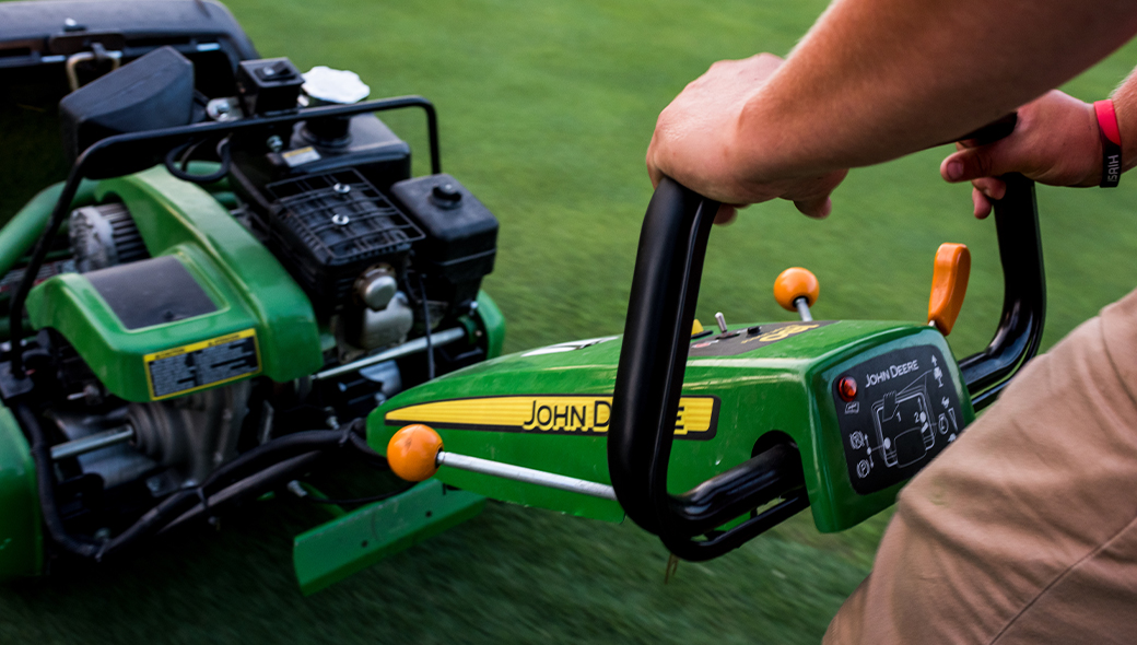 Close up of the 180 E-Cut™ Hybrid controls being used by a course attendant