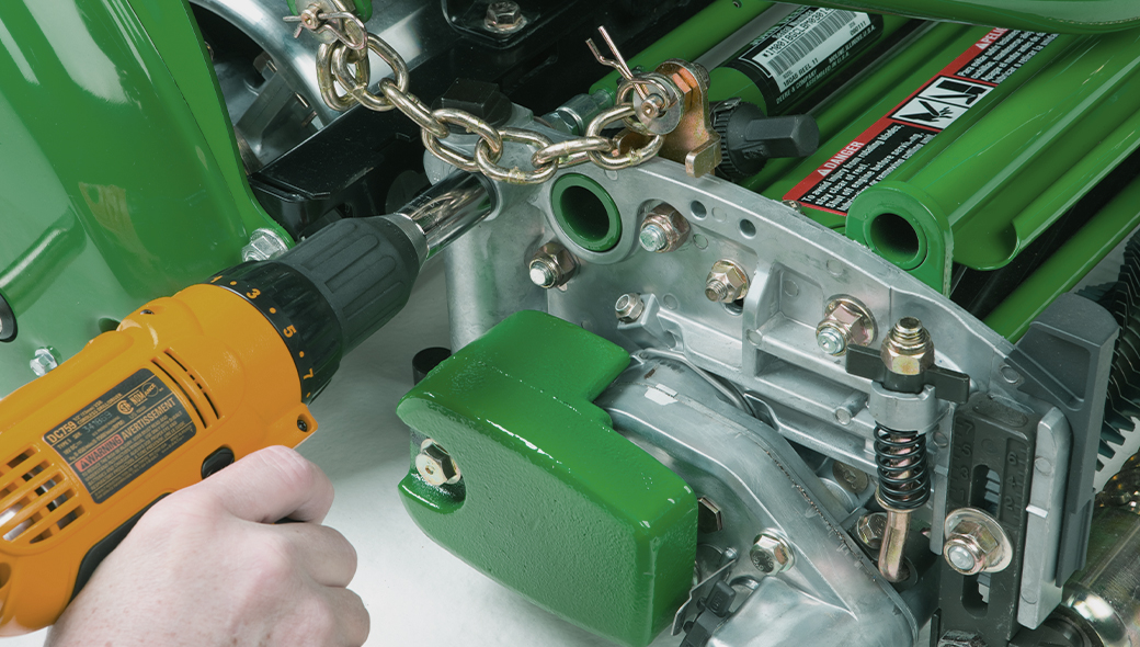 Close up of how to use a cordless drill to adjust the cut on the on the 180 E-Cut™ Hybrid