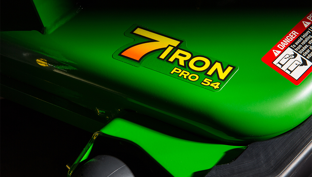 Closeup of the 7 Iron Pro 54 sticker on the mower deck