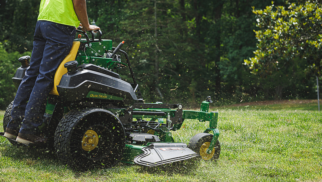 Stand on mower in use